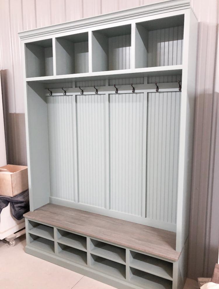 Elegant mudroom coat rack providing stylish organization for coats and accessories in an entryway.