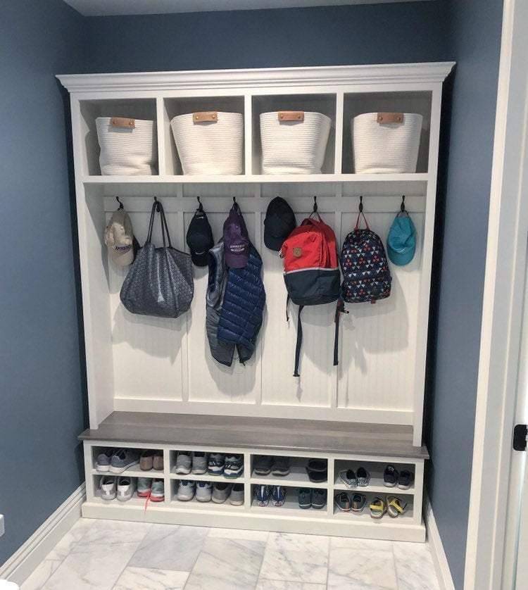 Elegant mudroom coat rack providing stylish organization for coats and accessories in an entryway.